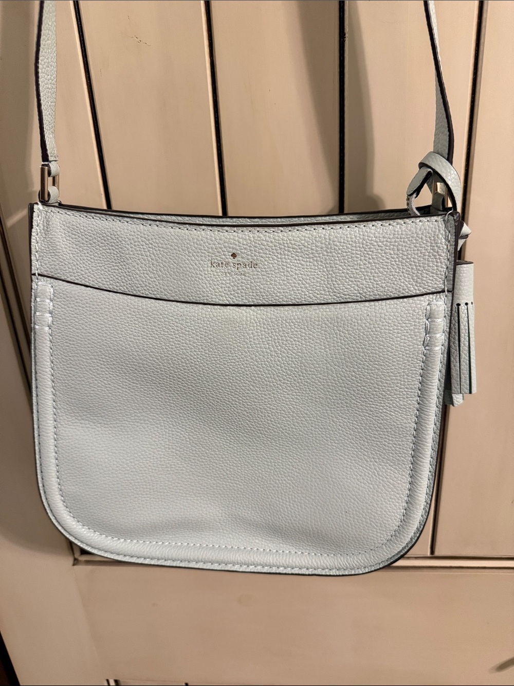 kate spade light green pebbled leather crossbody with tassel detail